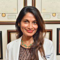 Female medical professional headshot in an office setting