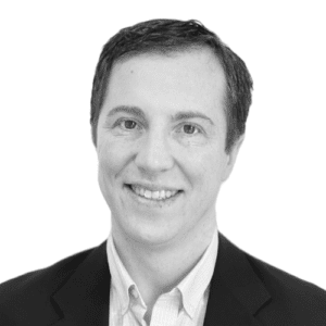 Black and white image of a man wearing a suit