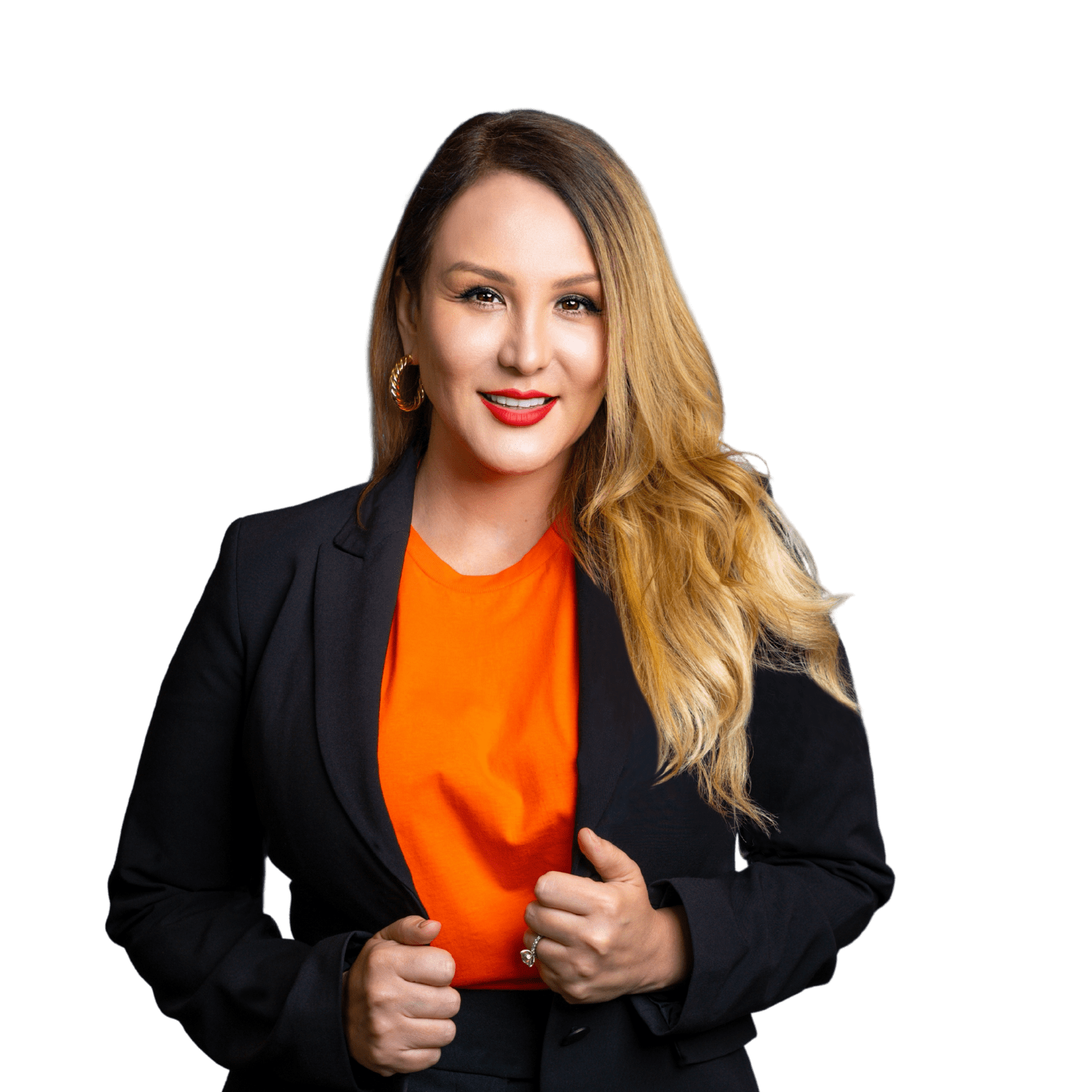 Perla Tamez Casanovas, host of the Caregiver Storyteller podcast in Spanish, wearing a black blazer and orange shirt.